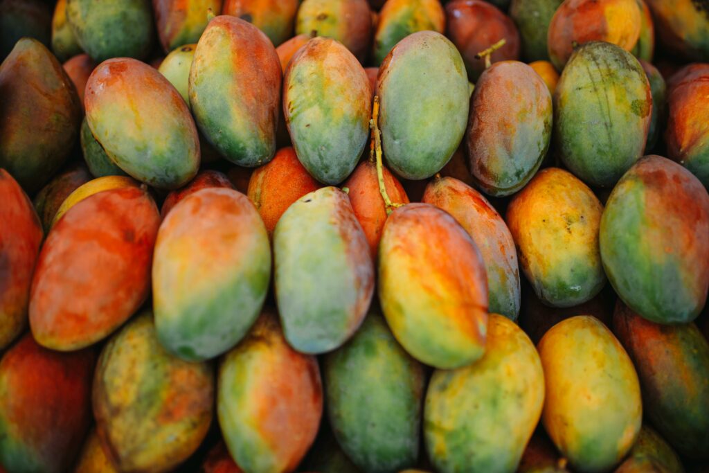 pexels photo 30893227 30893227 A vibrant collection of ripe mangoes showcasing their colorful natural hues.